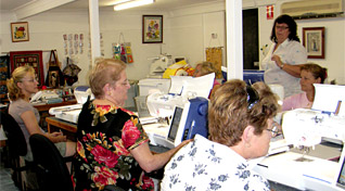 Rhonda Roberts and sewing students